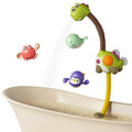 Shower head with wind-up toys for toddler bath time