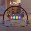 Baby play mat with giraffe print, featuring an arch with star-shaped hanging toys and softly glowing multicolored light-up buttons, set in a dimly lit nursery to attract baby's attention.