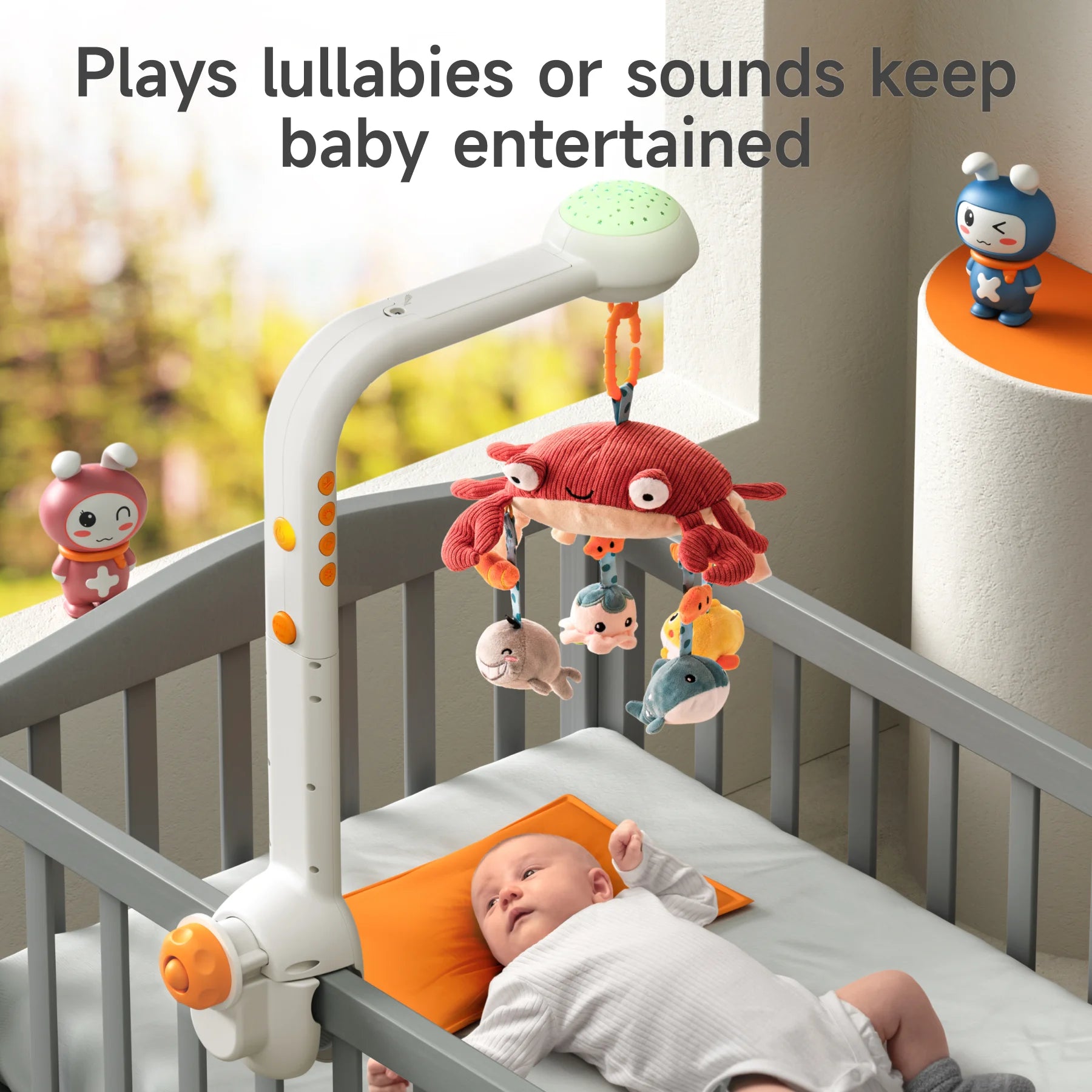 A baby lying in a crib watching a musical mobile featuring a red crab and plush sea animals. The mobile is attached to the crib rail and plays lullabies or soothing sounds to keep the baby entertained and calm. Bright, cheerful nursery décor surrounds the crib.