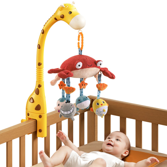 Giraffe-shaped baby crib mobile arm holding a red plush crab with dangling sea animal toys including fish, whales, and a smiling shark, designed for infant visual and sensory stimulation.