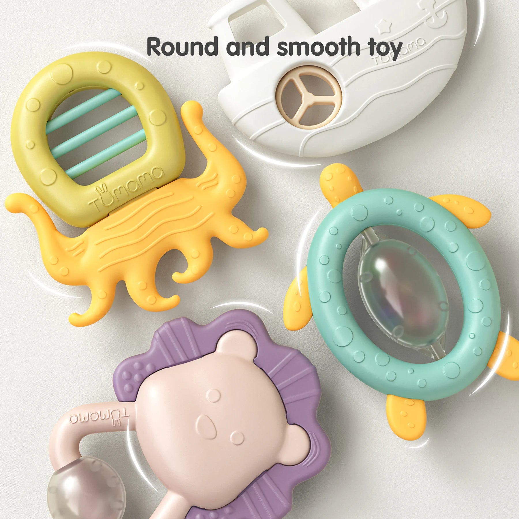 baby rattles and teethers with smooth, rounded edges arranged on a light surface. Designs include a yellow octopus, a white boat, a teal turtle, a purple lion with a clear rattle ball, and a yellow-green circular shape. Text at the top reads “Round and smooth toy,” emphasizing baby-safe construction.