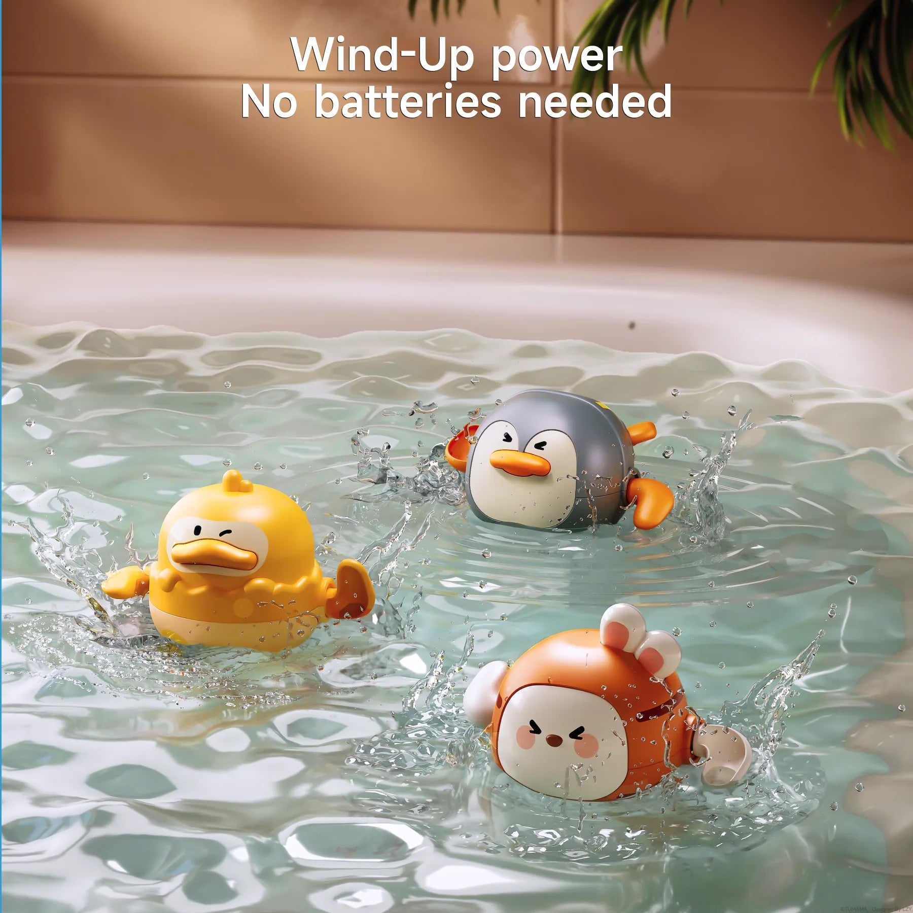 Three colorful wind-up bath toys shaped like a duck, penguin, and bunny swim and splash in a bathtub filled with water. The toys are in motion, creating ripples and splashes. Text at the top reads: “Wind-Up power – No batteries needed.”