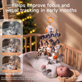 Baby lying on back in a wooden crib, gazing up and reaching at a hanging black-and-white newborn mobile with a plush birch-patterned branch and dangling owl, panda, star, pelican, and bat toys; side infographic panels labeled 0–3 Months, 3–6 Months, 6–12 Months illustrate how the high-contrast mobile helps improve focus and visual tracking in early development.