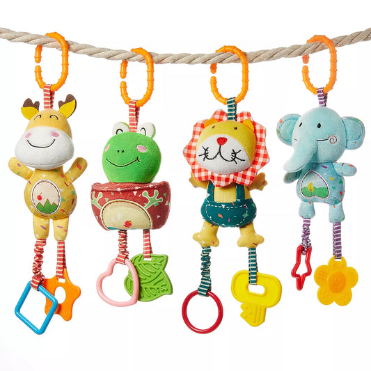 Four colorful plush baby rattles shaped like a giraffe, frog, lion, and elephant, each hanging by an orange clip with dangling plastic rings and shapes, displayed on a rope