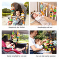 Four-panel collage showing a smiling baby with four hanging soft animal rattles: a lion, frog, elephant, and giraffe attached to a stroller canopy, crib rail, car seat headrest, and held outdoors to entertain on the go.