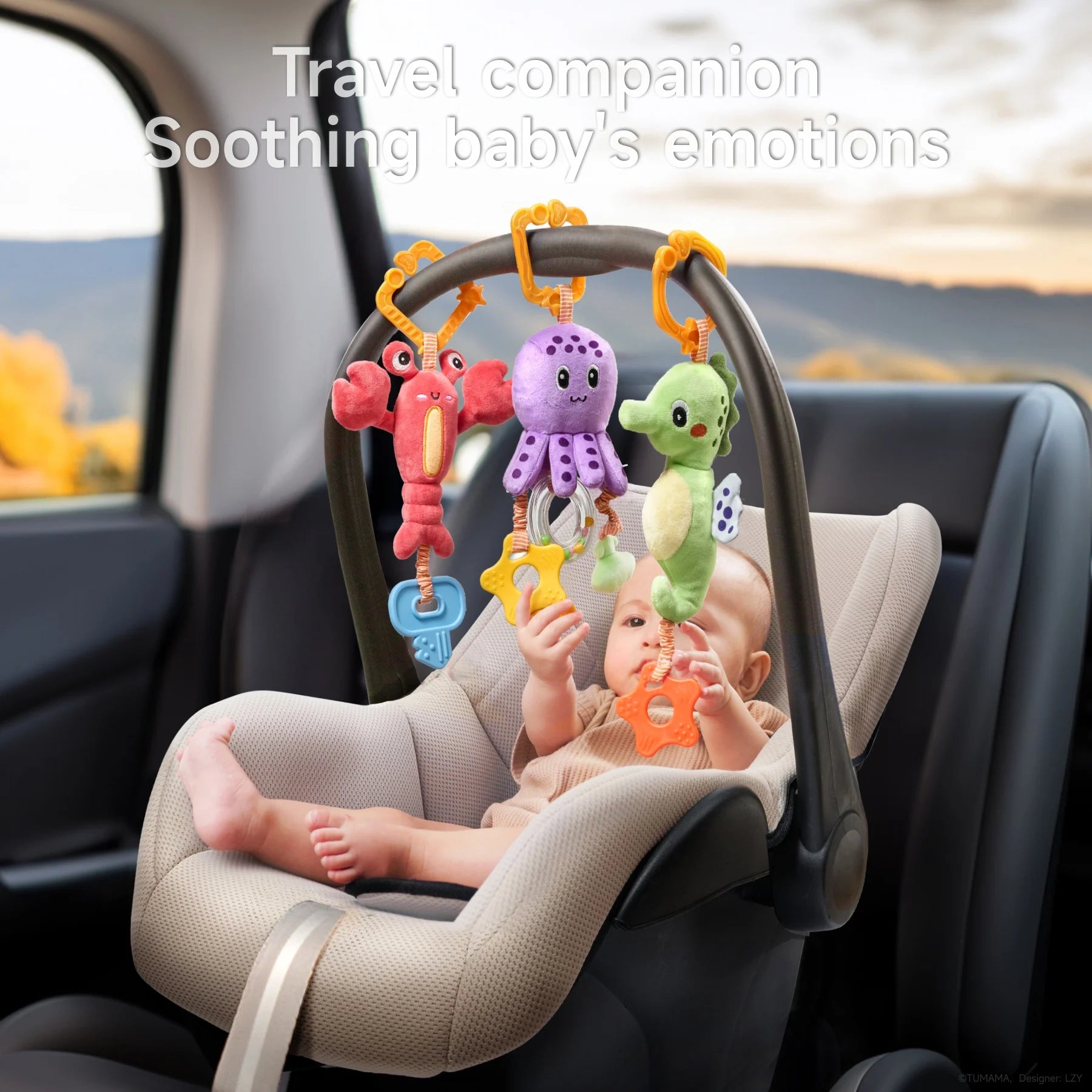 Baby in a car seat reaching out to colorful marine-themed plush hanging toys—a red lobster, purple octopus, and green seahorse—secured to the car seat handle with orange clips, with the text “Travel companion, Soothing baby’s emotions” displayed above.