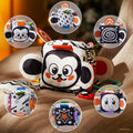 High-contrast baby sensory cube toy with multiple sides featuring black and white patterns, cute animal faces, stars, and spirals. The soft cube includes colorful tags, crinkle textures, and attached teethers to stimulate visual development and sensory exploration for infants.
