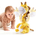 A baby in a brown outfit crawling on the floor next to a yellow giraffe plush electric interactive toy with a rotating neck. The background shows motion blur to emphasize the toy’s movement.