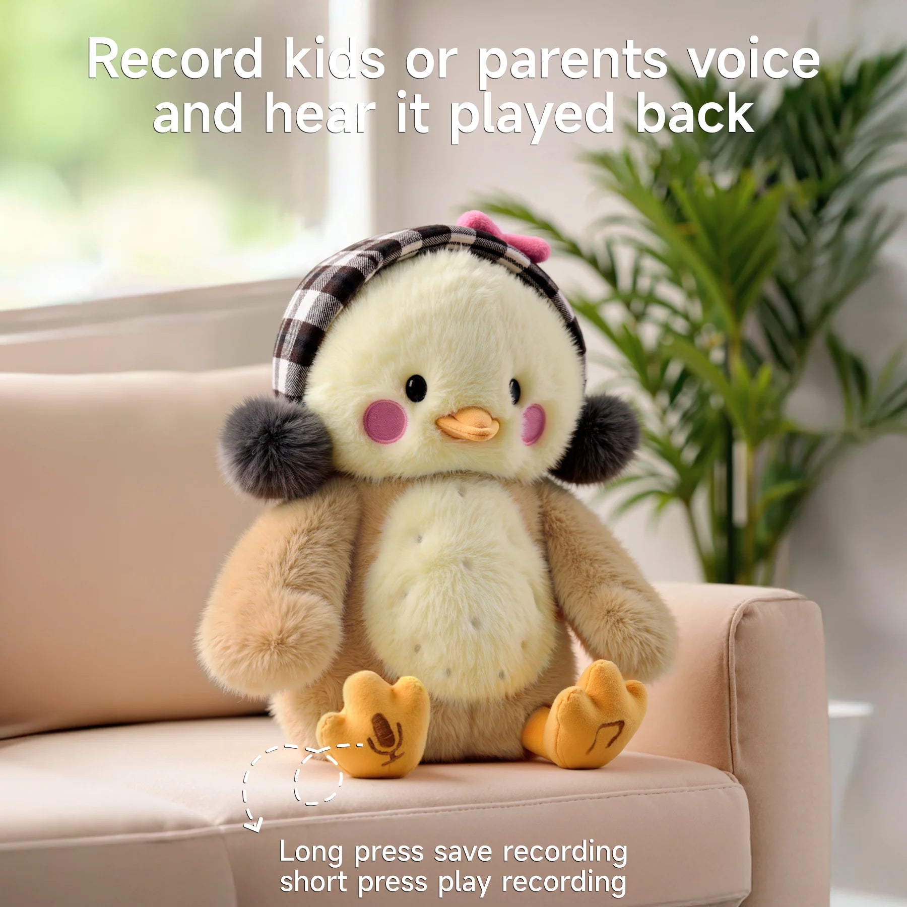 Interactive chick plush toy sitting on a couch, wearing checkered earmuffs and a pink bow, with recording and playback features for kids and parents, indicated by icons on its feet.