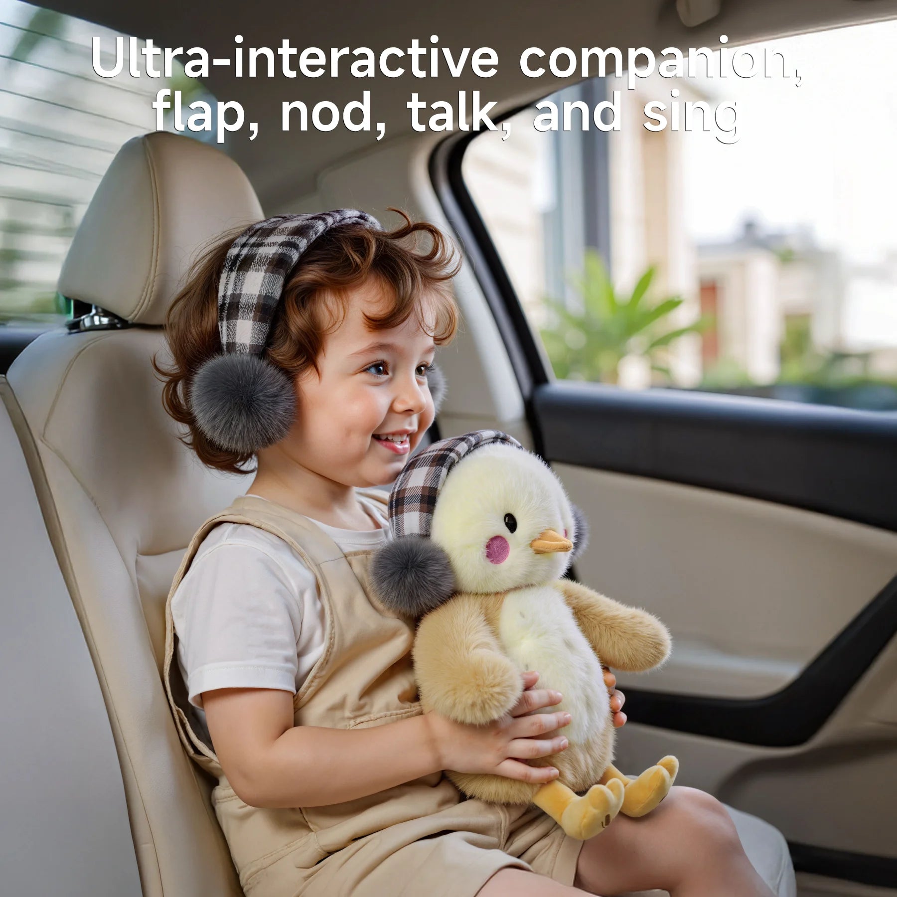 Smiling toddler sitting in a car seat and holding an interactive chick plush toy with checkered earmuffs, designed to flap, nod, talk, and sing — a perfect travel companion.