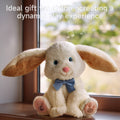 Plush bunny interactive toy with long floppy ears and a blue bow tie sitting on a windowsill, accompanied by overlay text describing it as an ideal gift that creates a dynamic play experience, with musical notes floating in the background.