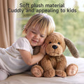 A young child cuddling a soft, brown plush dog toy on a bed, showing the toy’s cozy and appealing design for kids.
