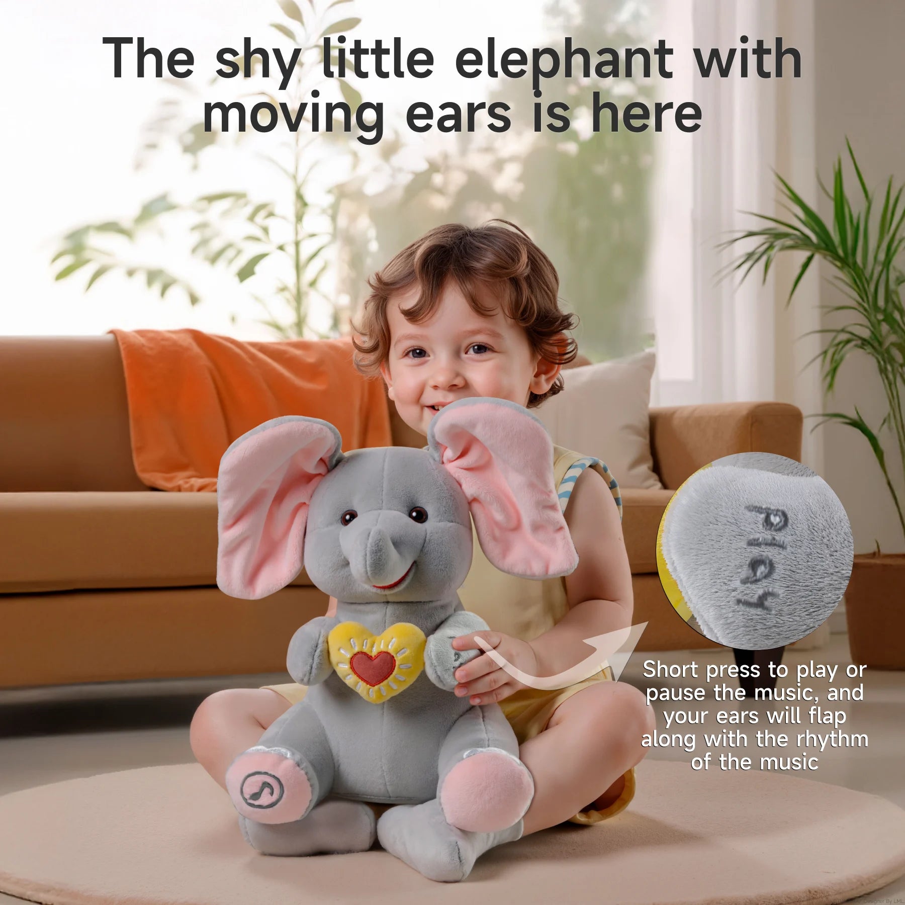 Smiling child sitting on a rug and holding a plush elephant toy with large pink ears and a yellow heart. Text reads: “The shy little elephant with moving ears is here.” An inset highlights the "play" button on the elephant's arm with a caption explaining that pressing it will play or pause music while the ears flap to the rhythm.