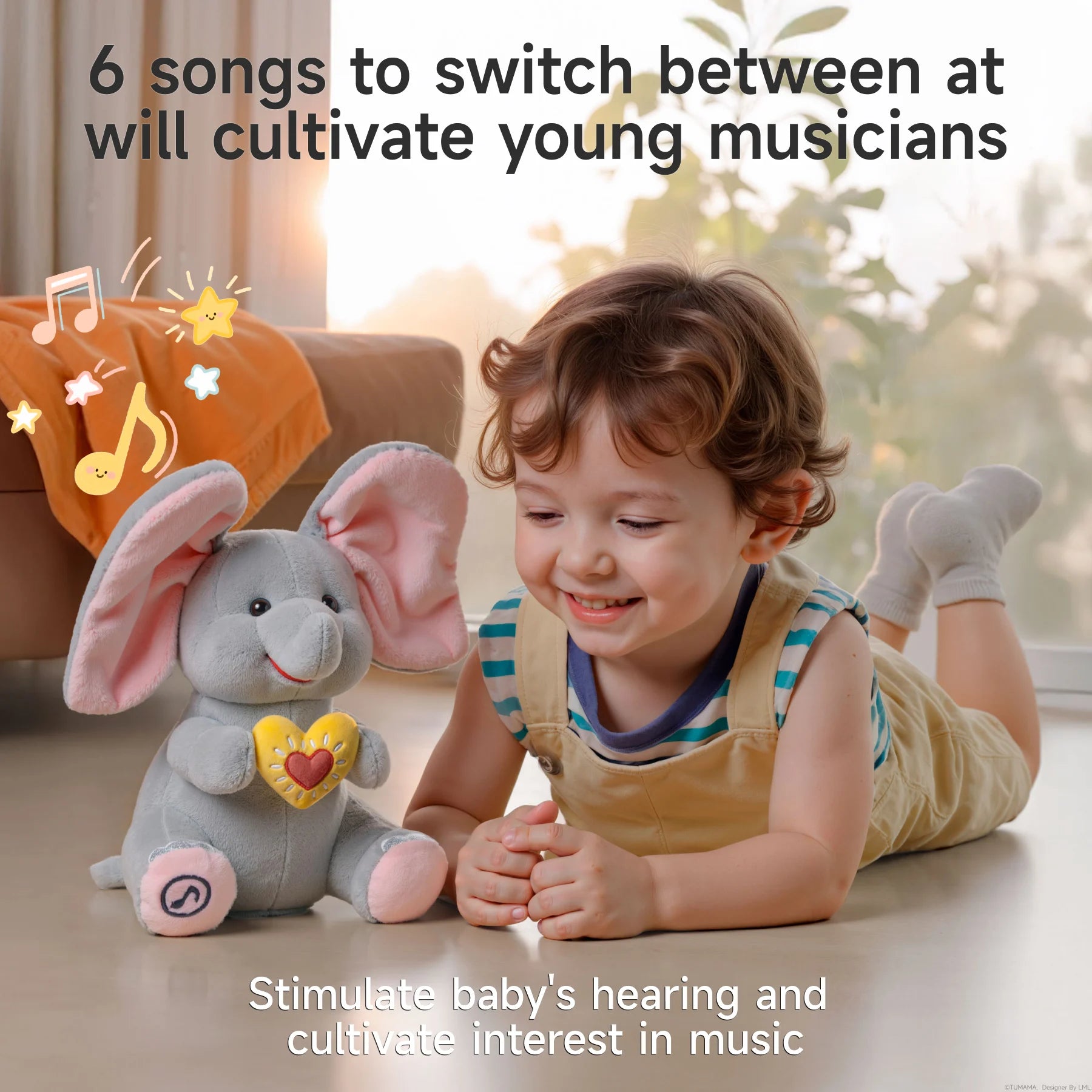 Smiling child lying on the floor next to an animated elephant plush toy with pink ears and a yellow heart, surrounded by musical note and star graphics. Text reads: “6 songs to switch between at will cultivate young musicians” and “Stimulate baby’s hearing and cultivate interest in music.”