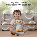 Happy toddler sitting on the floor holding an interactive owl plush toy, with labeled features displayed around them: 