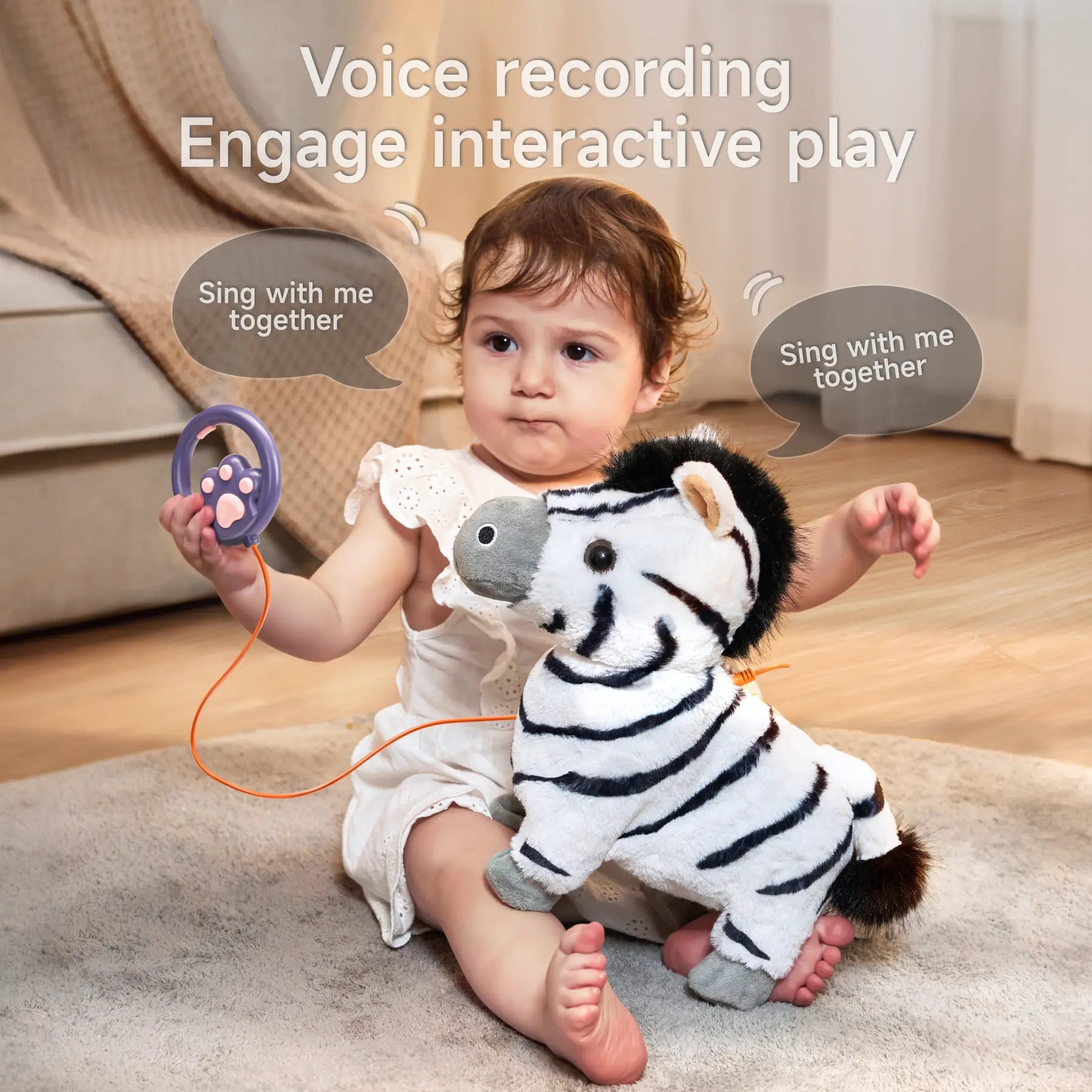 Toddler sitting on a soft carpet holding an interactive zebra plush toy with black stripes, gray hooves, and a black mane. The child is also holding a purple paw-shaped voice recording remote connected by an orange cord. Text on the image highlights 'Voice recording' and 'Engage interactive play' with speech bubbles saying 'Sing with me together'.