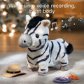 Interactive zebra plush toy with black and white stripes, standing on a soft rug. A tan cowboy hat lies on the left and a purple paw-shaped remote with an orange cord is on the right. Musical notes float in the background under the text: 'Walk, sing, voice recording, twist body', indicating the toy's multifunctional features.