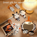 Black and white toys mirror plush baby toy rattle book set on the floor
