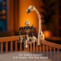 Zebra-themed crib mobile with plush owl, panda, pelican, and other animal toys hanging above a crib, labeled as AA battery version.