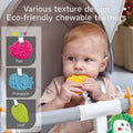 Baby seated in a stroller chewing on a yellow teether shaped like a pineapple; side panel displays other eco-friendly textured teether designs including a pink fish, blue pineapple, and green leaf, with note of random color variation. Text reads: 'Various texture design, Eco-friendly chewable teethers'.