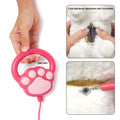 Close-up of a pink paw-shaped remote control for a toy dog with ON/OFF button, and two insets showing battery installation using 3 AA batteries and a headphone jack-style connection for the leash.