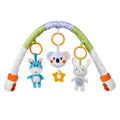 The baby is happily playing with the plush toys on the stroller arch toy