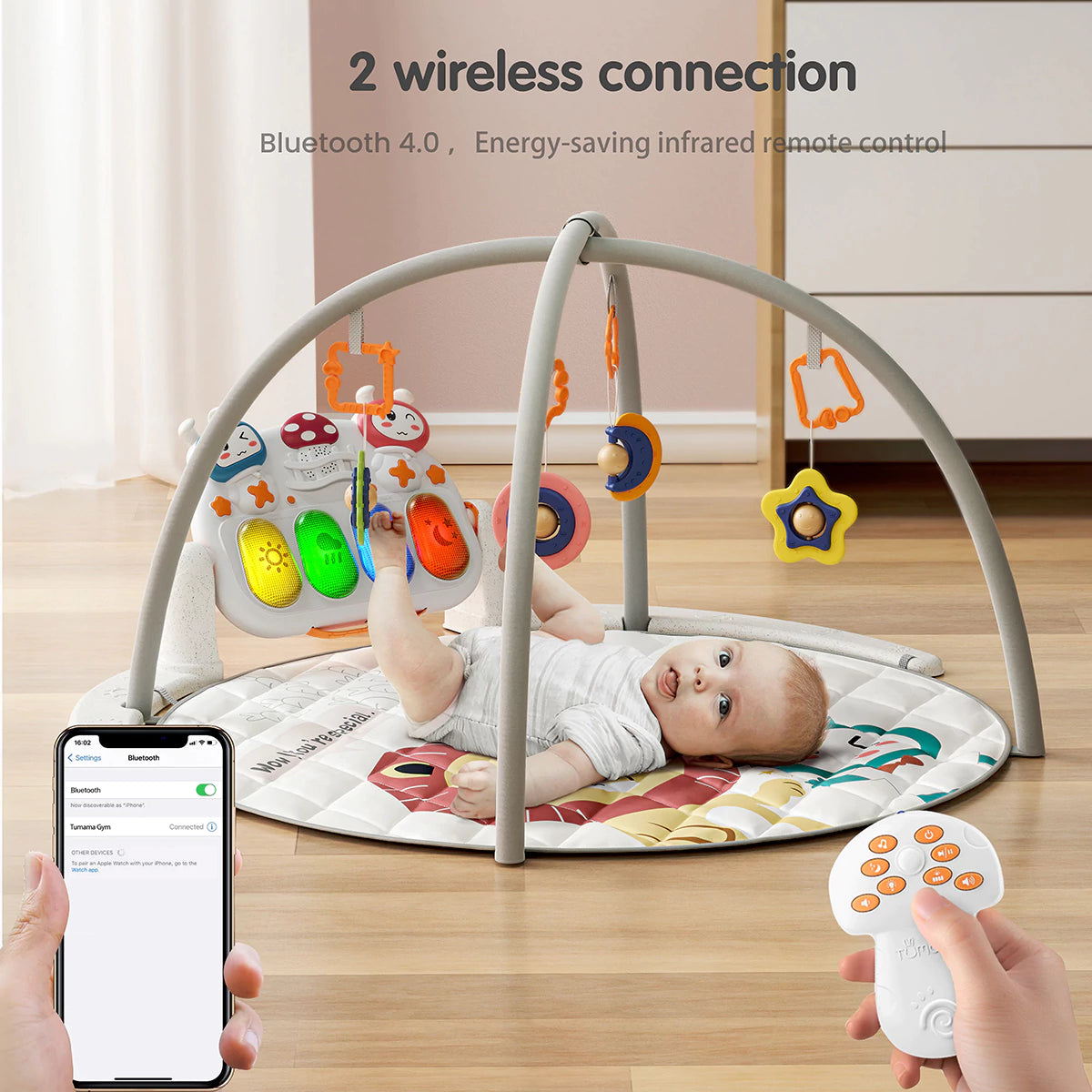 Baby activity gym play mat with colorful hanging rattles and a light-up musical keyboard, showing a baby lying underneath while Bluetooth 4.0 and remote control functions are demonstrated.
