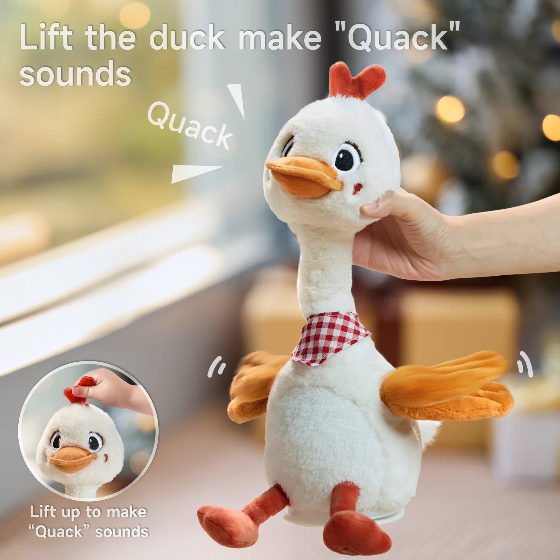 A hand lifts the talking and dancing duck toy, making it produce 'Quack' sounds. The duck's body is animated as it reacts to being lifted, and the toy's wings flap playfully.