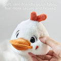 Close-up of the soft, skin-friendly plush fabric of the duck toy, offering a secure and relaxing feel.