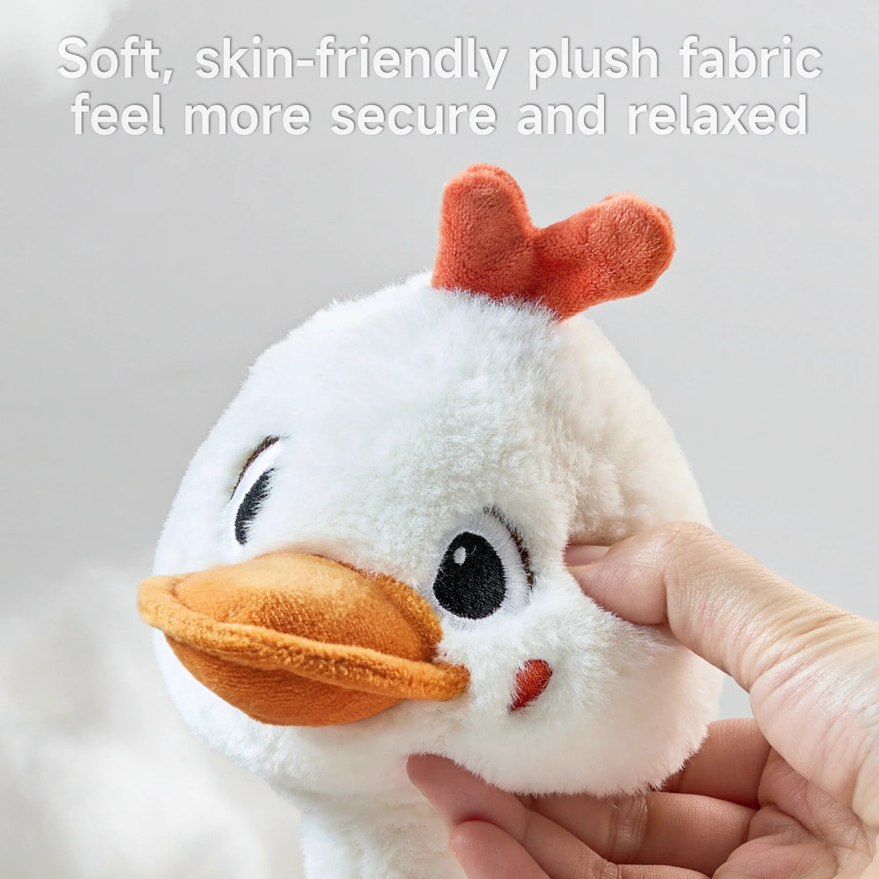 Close-up of the soft, skin-friendly plush fabric of the duck toy, offering a secure and relaxing feel.