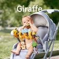 A baby sitting in a stroller, chewing on a green elephant-shaped teether from a giraffe-themed spiral toy. The toy features a plush giraffe, lion, tree bead, and bead rattle, securely attached to the stroller for interactive fun.