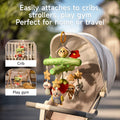A Woodland Animal Crib Mobile attached to a baby stroller outdoors, featuring a green tree branch design with a plush bee and red flower at the top. Hanging plush toys include stars, a ladybug, an owl, a strawberry, a sloth, and a raccoon. The image also includes two insets showing the mobile attached to a crib and a play gym. Text on the image reads, 