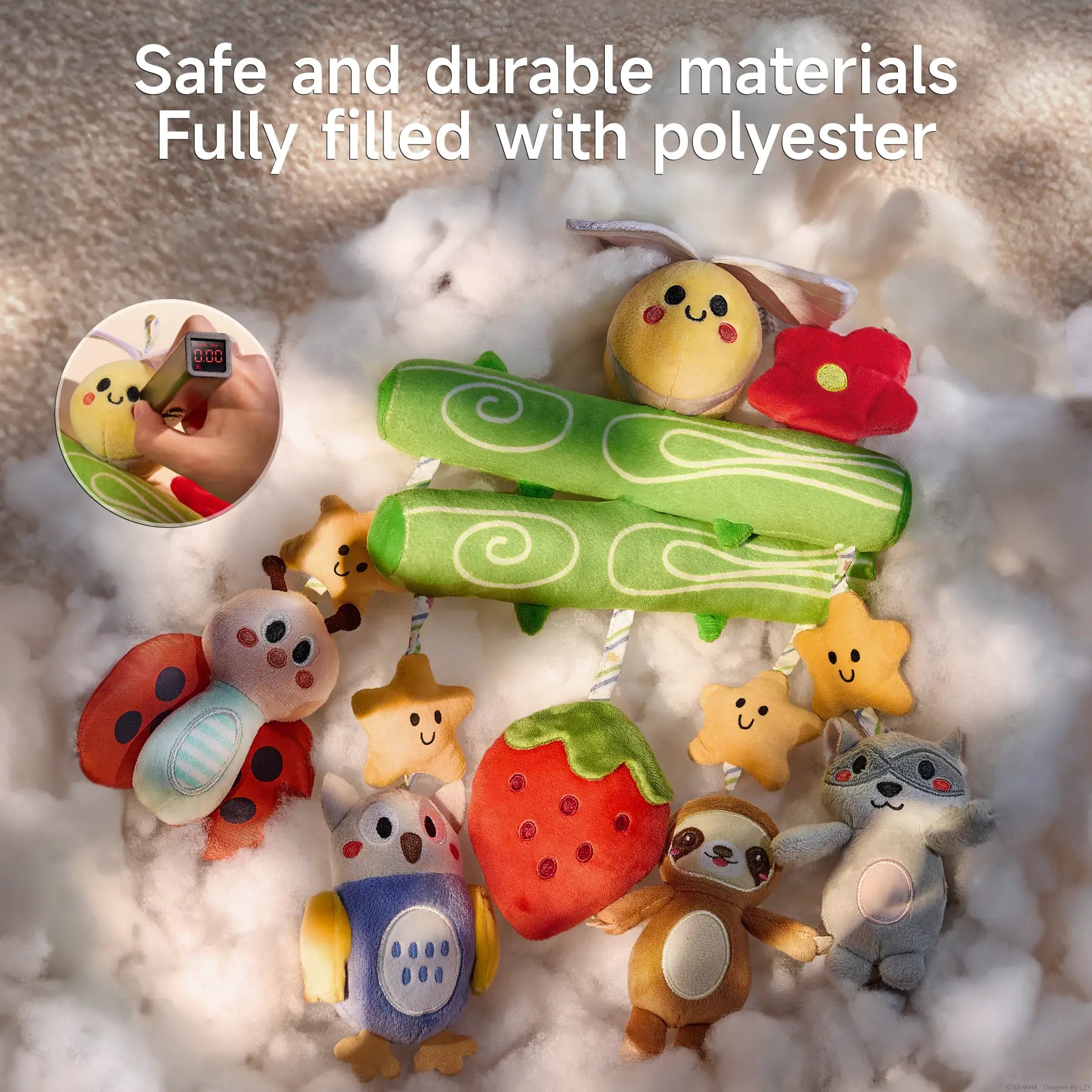 A Woodland Animal Crib Mobile displayed on a fluffy white surface, emphasizing its soft and plush texture. The mobile features a green tree branch design with a plush bee and red flower on top, and hanging plush toys including stars, a ladybug, an owl, a strawberry, a sloth, and a raccoon. An inset shows a close-up of a hand using a gauge to test material safety. Text on the image reads, "Safe and durable materials. Fully filled with polyester."
