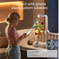 A mother using her smartphone to connect via Bluetooth to a smart crib mobile featuring plush toys (ladybug, owl, raccoon, and sloth). The mobile is attached to a crib, projecting soft lights and playing custom lullabies.