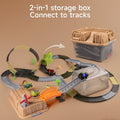 2-in-1 dinosaur-themed toy race track set featuring a multi-level loop and bridge layout connected to a storage box that doubles as part of the track system, with cars, dinosaurs, and accessories arranged on a tan background.