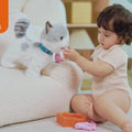 The little boy and girl are happily playing with Interactive Walking Cat Toy for Kids with a Leash in the living room